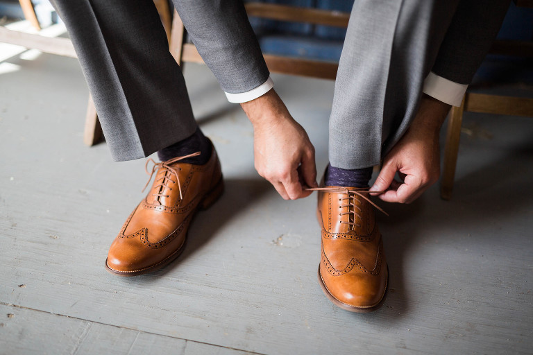 groom typing brown leather shoes